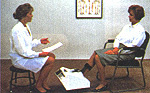 A person sits while recieving an ultrasound bone density scan